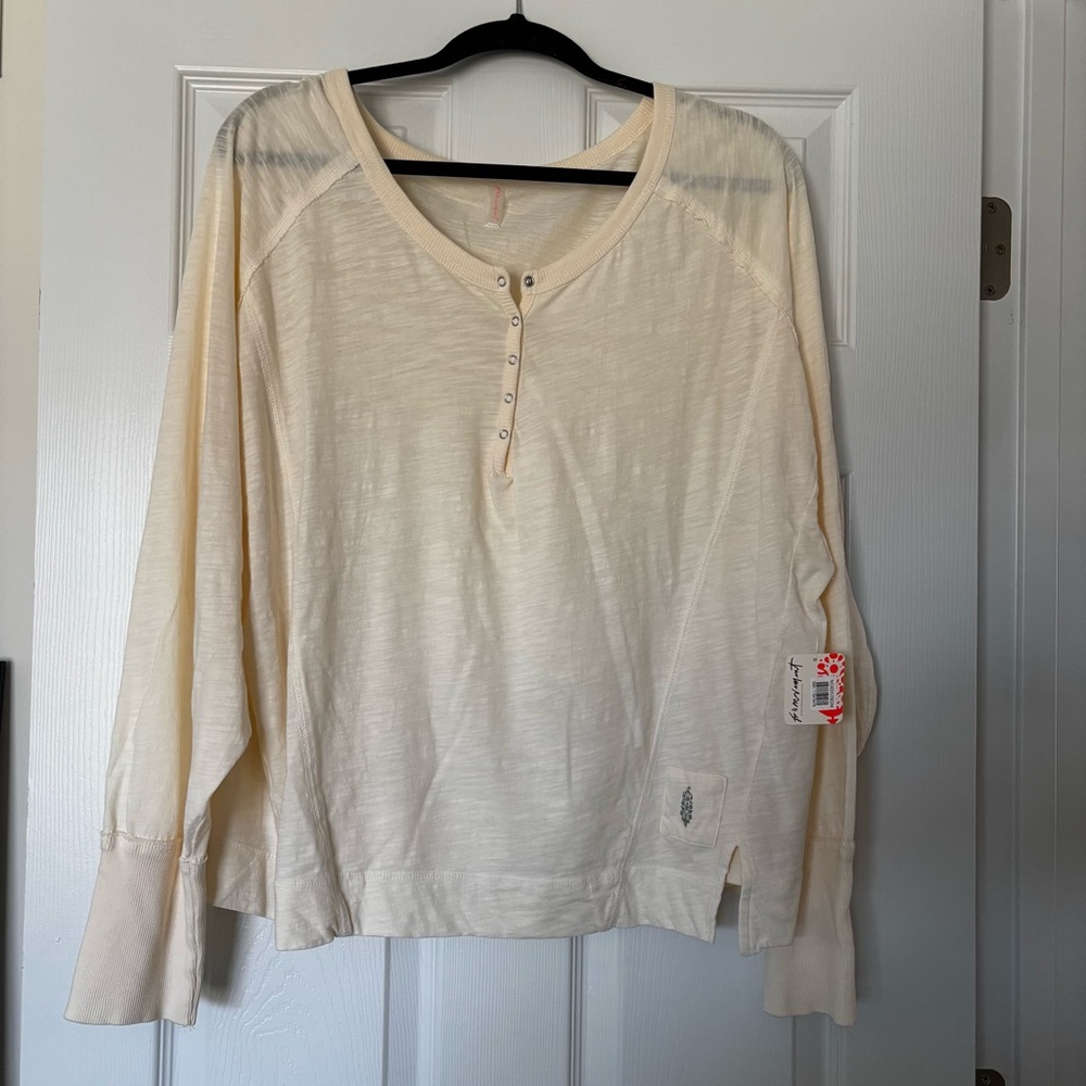 NWT Free People Movement winner layer top sz L cream
